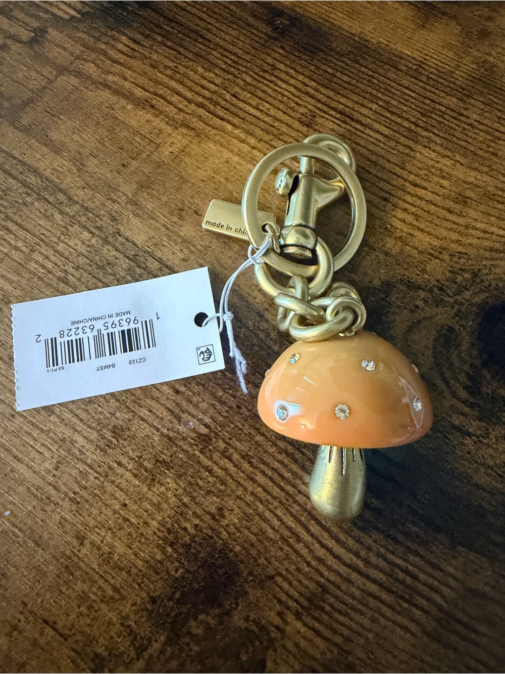 Coach Gold-Tone Keychain with Orange Mushroom Charm - Picture 3 of 3